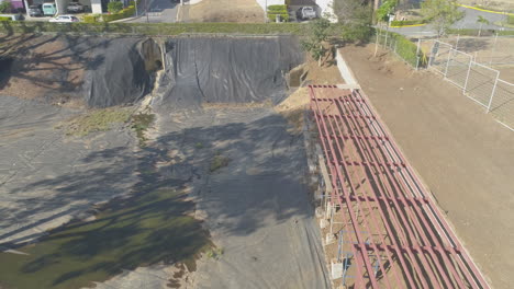 aerial-video-of-sewage-treatment-plants,-residential-retention-ponds-around-residential-deck-construction