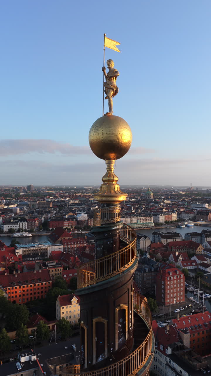 Aerial drone view of the iconic spiral tower of the Church of Our Saviour in Copenhagen, Denmark. Vertical