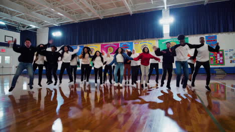 students dancing in a school gym