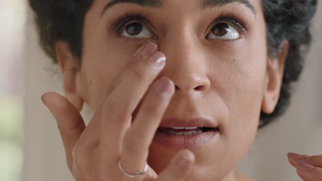 portrait beautiful young woman looking in mirror at perfect healthy skin touching face with hands enjoying smooth natural complexion with anti aging skincare getting ready at home beauty concept