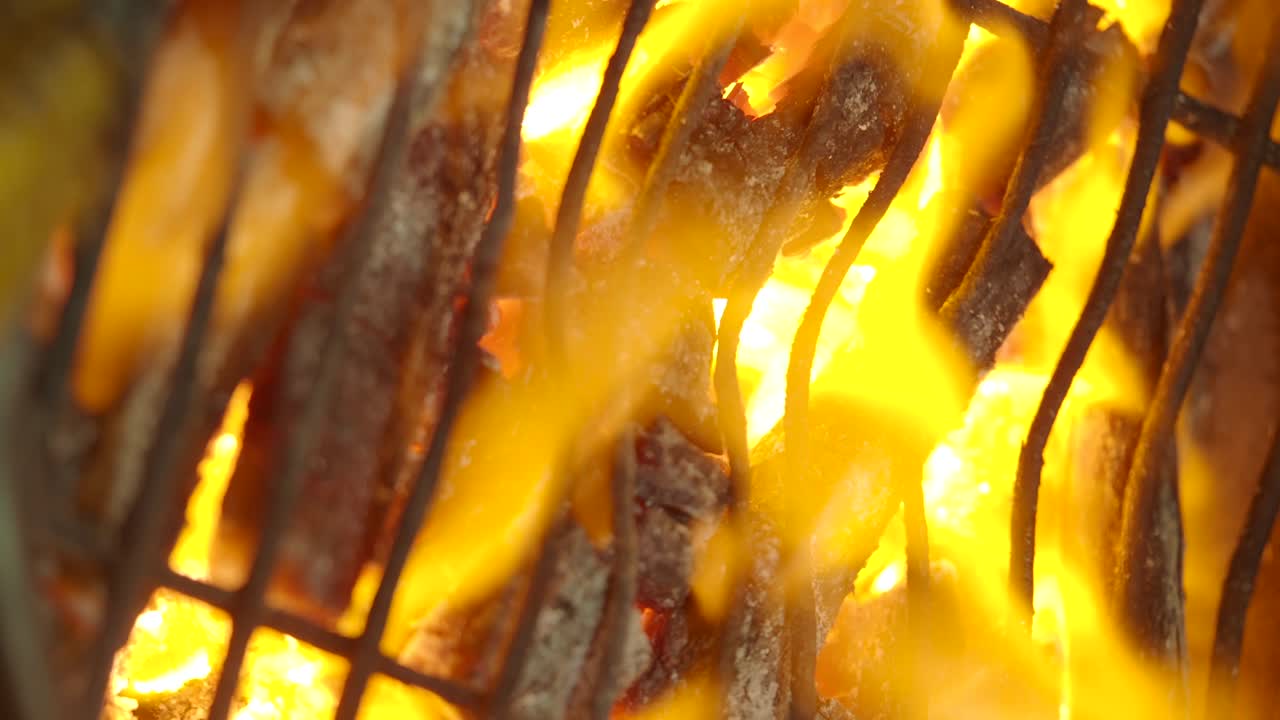 Close-up of food on a grill with flames