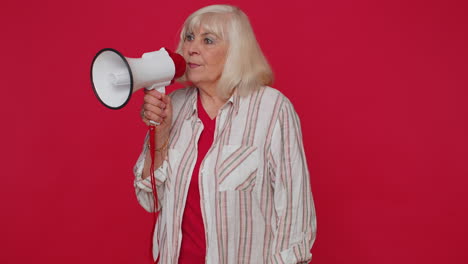 Smiling-senior-woman-talking-with-megaphone-proclaiming-news-loudly-announcing-sale-advertisement