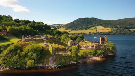 aerial pan of urquhart castle on loch ness in scottish highlands, inverness, scotland