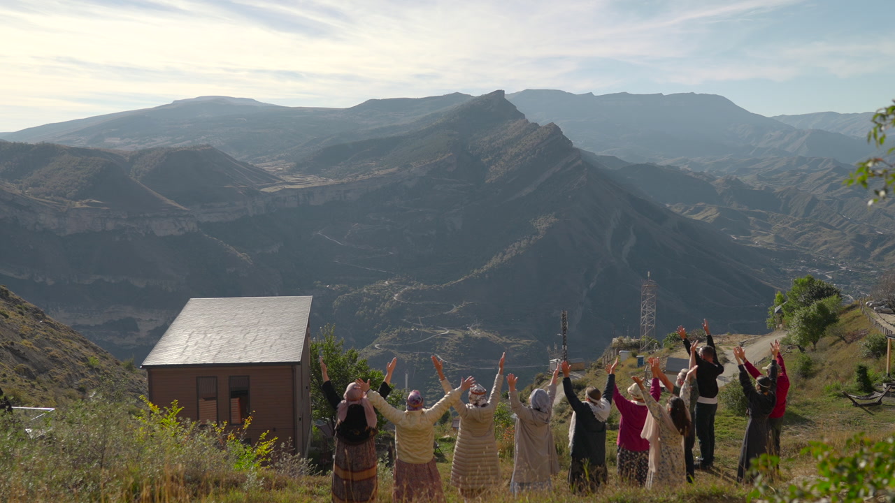 Mountain Vista With Villagers Raising Hands In Dawn Ceremony Small Wooden Cabin On Ridge, Locals Performing