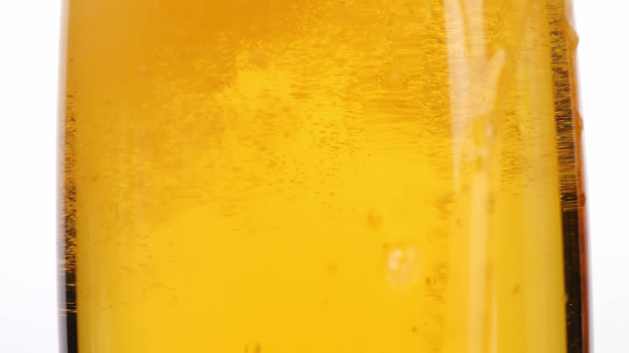 Close-up of a Golden Liquid in a Glass