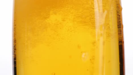 close-up of a golden liquid in a glass