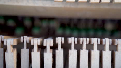 closeup of old broken piano inside