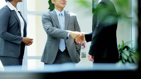 ambitious multi ethnic business executives in office meeting