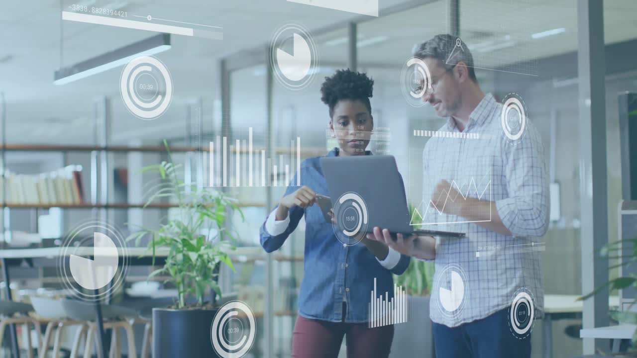 Woman tapping laptop and colleague pointing charts while animating dashboard for business review