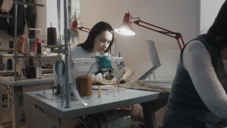 women working on sewing machines in a tailoring workshop