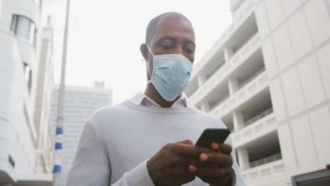 african american man on the go wearing coronavirus covid19 mask