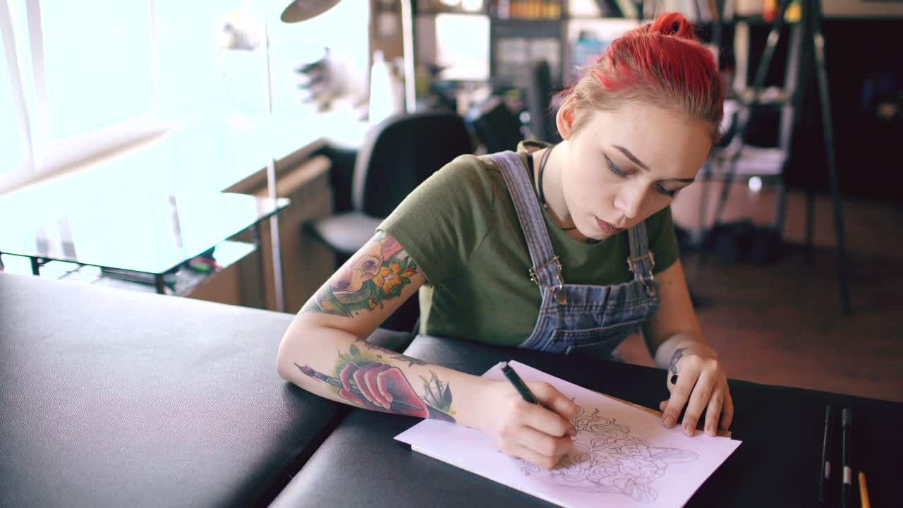 Tattoo Artist Working on a Design