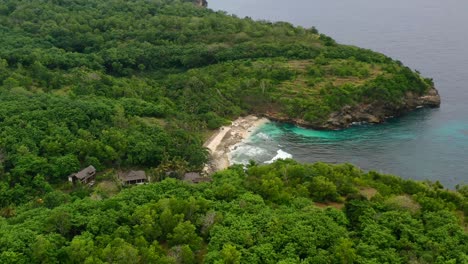 private-secret-white-sand-beach-on-tropical-Nusa-Ceningan-Island-in-Indonesia,-aerial