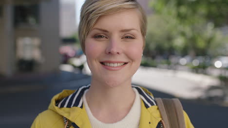 portrait of beautiful blonde woman laughing cheerful enjoying city travel