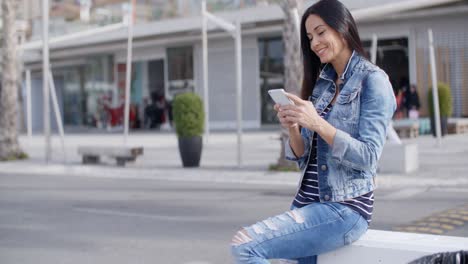 trendy attractive young woman in a denim outfit