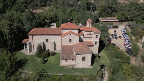 reverse and upward flight with drone in the majestic sanctuary of the virgin of chilla, 16th century, we see its rear structure and its variety of roofs, it is surrounded by gardens, it is fascinating