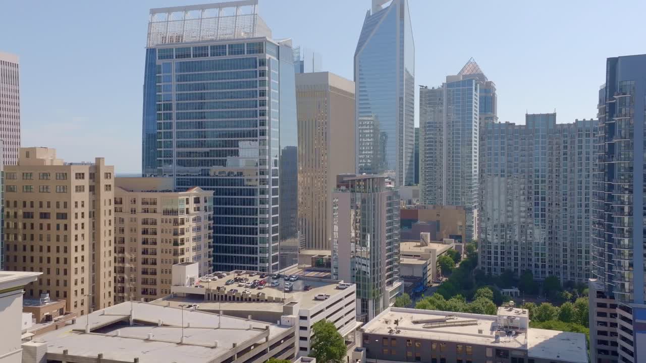 Commercial office skyline buildings in Uptown Charlotte, North Carolina, Revealing drone shot