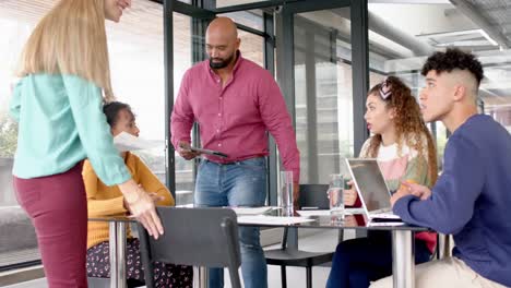 Busy-diverse-business-people-discussing-work-at-meeting-in-office-in-slow-motion