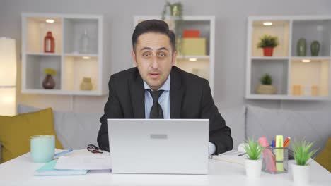home office worker man looking at camera curious and confused.
