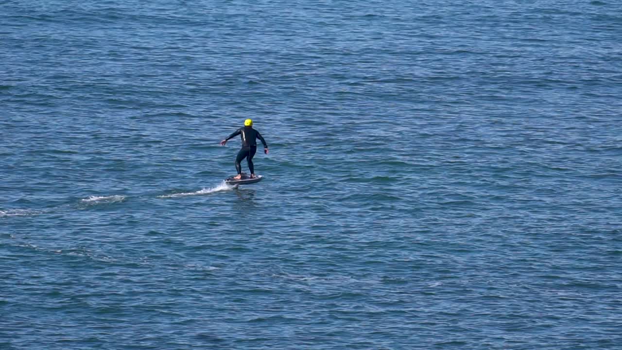 Static view of a speed surfer training with his jetsurf. Daylight