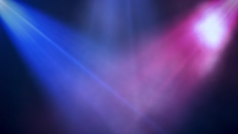 iluminación del escenario con focos azules y rosados