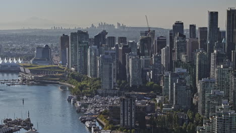 vancouver bc canada aerial v82 zoomed drone flyover the marina capturing coal harbour along the burrard inlet waterfront and upscale downtown cityscape views - shot with mavic 3 pro cine - july 2023