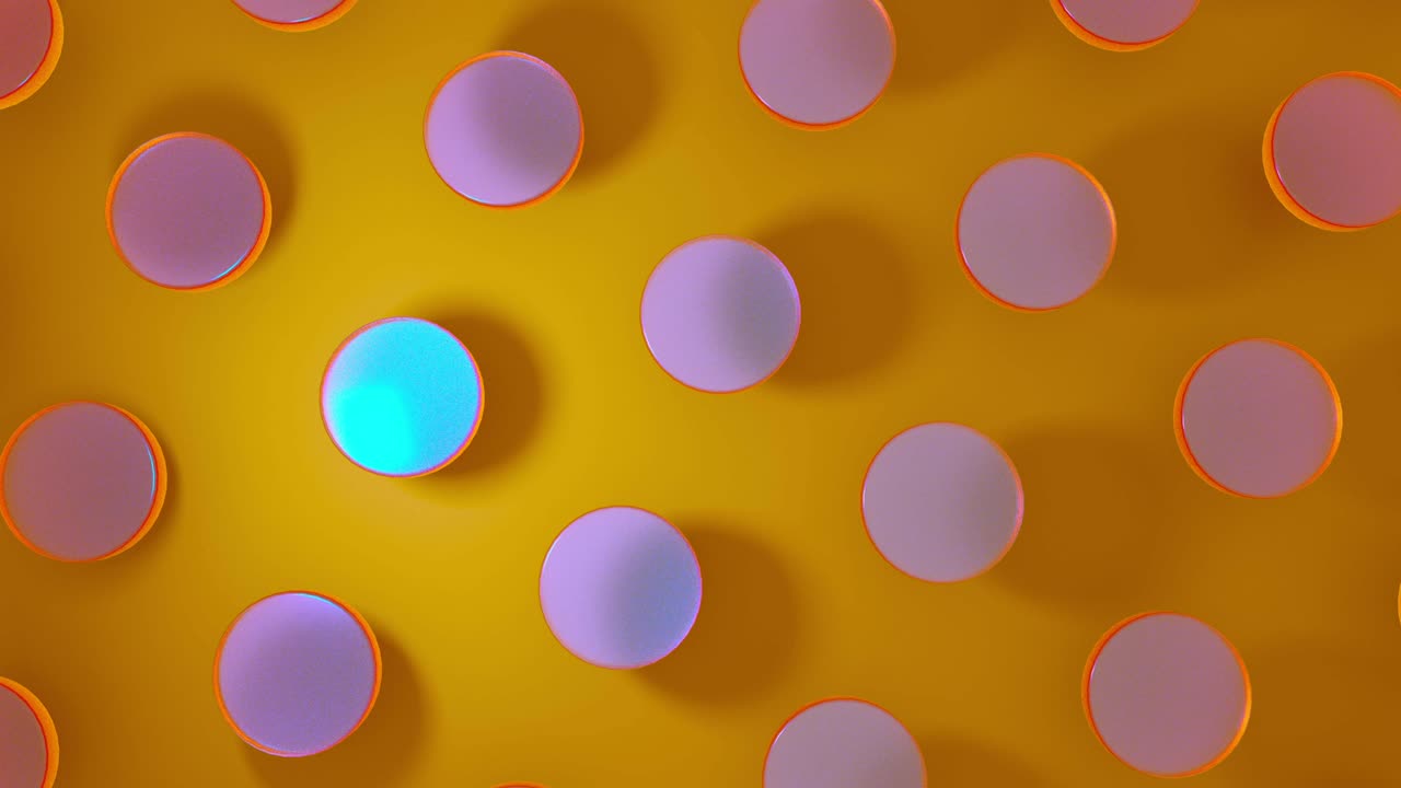 3D computer rendering of crystal glass round objects rotating on yellow background. 4K seamless loop animation footage.
