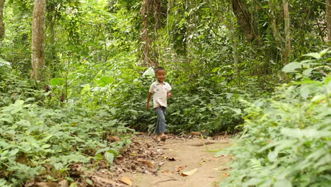 boy walking through the jungle