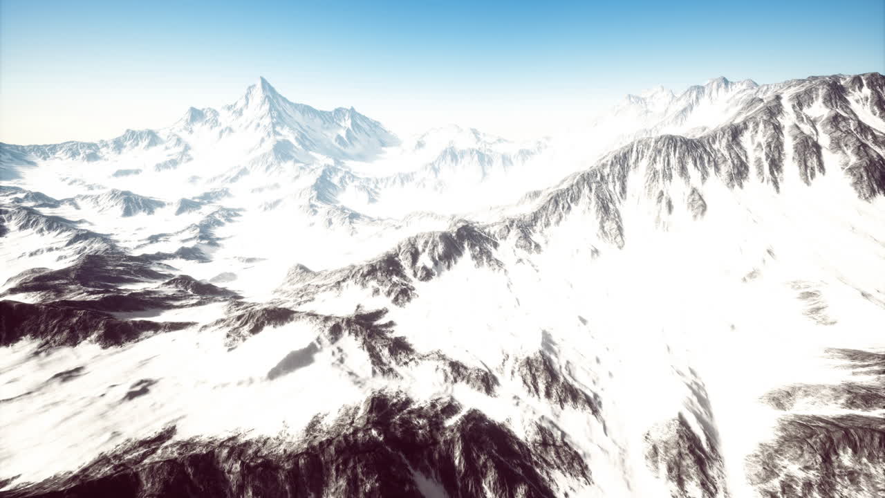 Majestic snow covered mountains basking in the bright sunlight