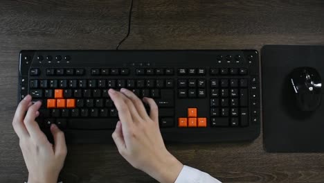 person typing on the computer keyboard