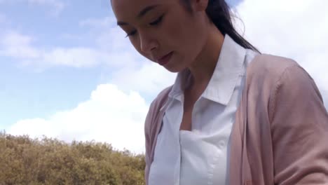 Businesswoman-using-laptop-in-the-park