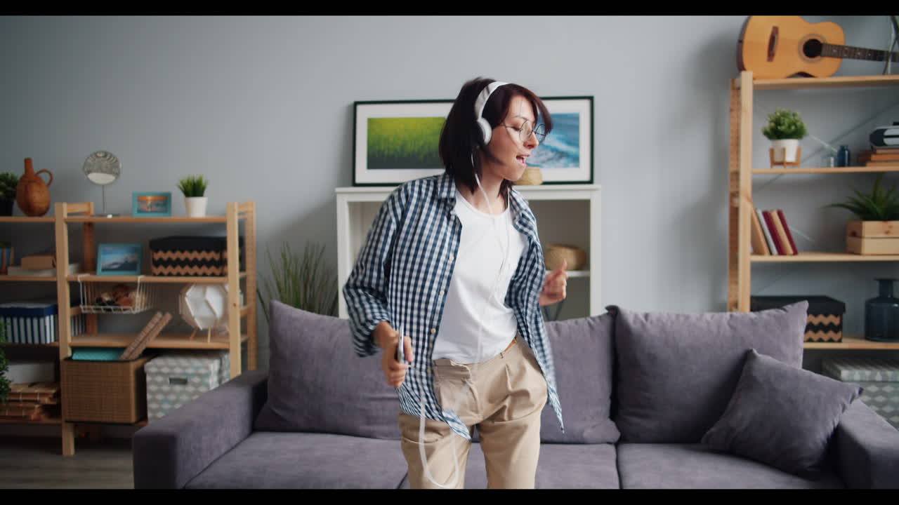 Woman Dancing to Music at Home