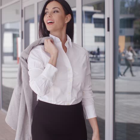 business woman with jacket over shoulder