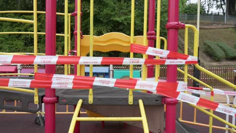 A-closed-slide-play-with-tapes-and-barriers-seen-at-a-public-playground-due-to-the-Covid-19-Coronavirus-outbreak-and-restrictions-in-Hong-Kon