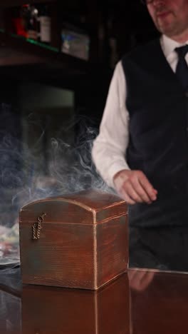 bartender preparing a cocktail with dry ice