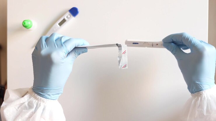 Doctor testing using the rapid test device for covid19