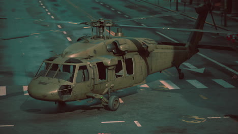 damaged military helicopter in city street at night