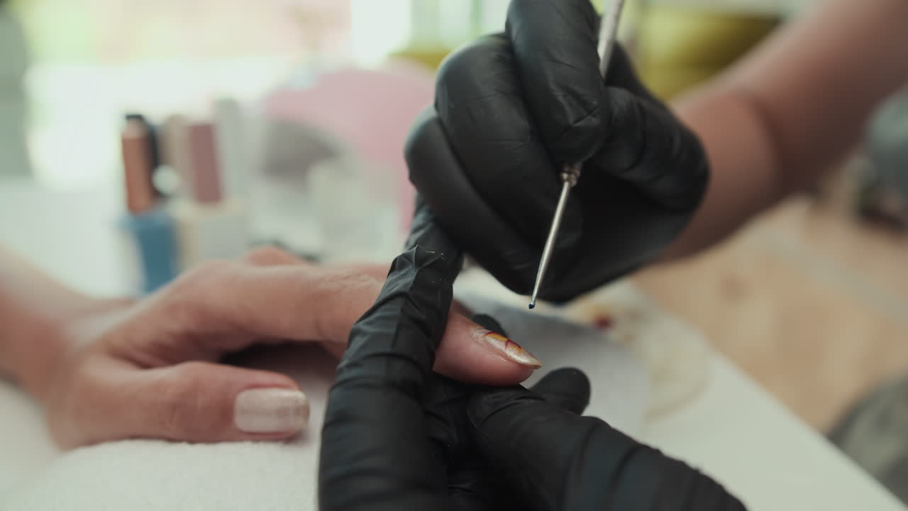 Specialist Applying Decor on Nails of Client in Beauty Studio
