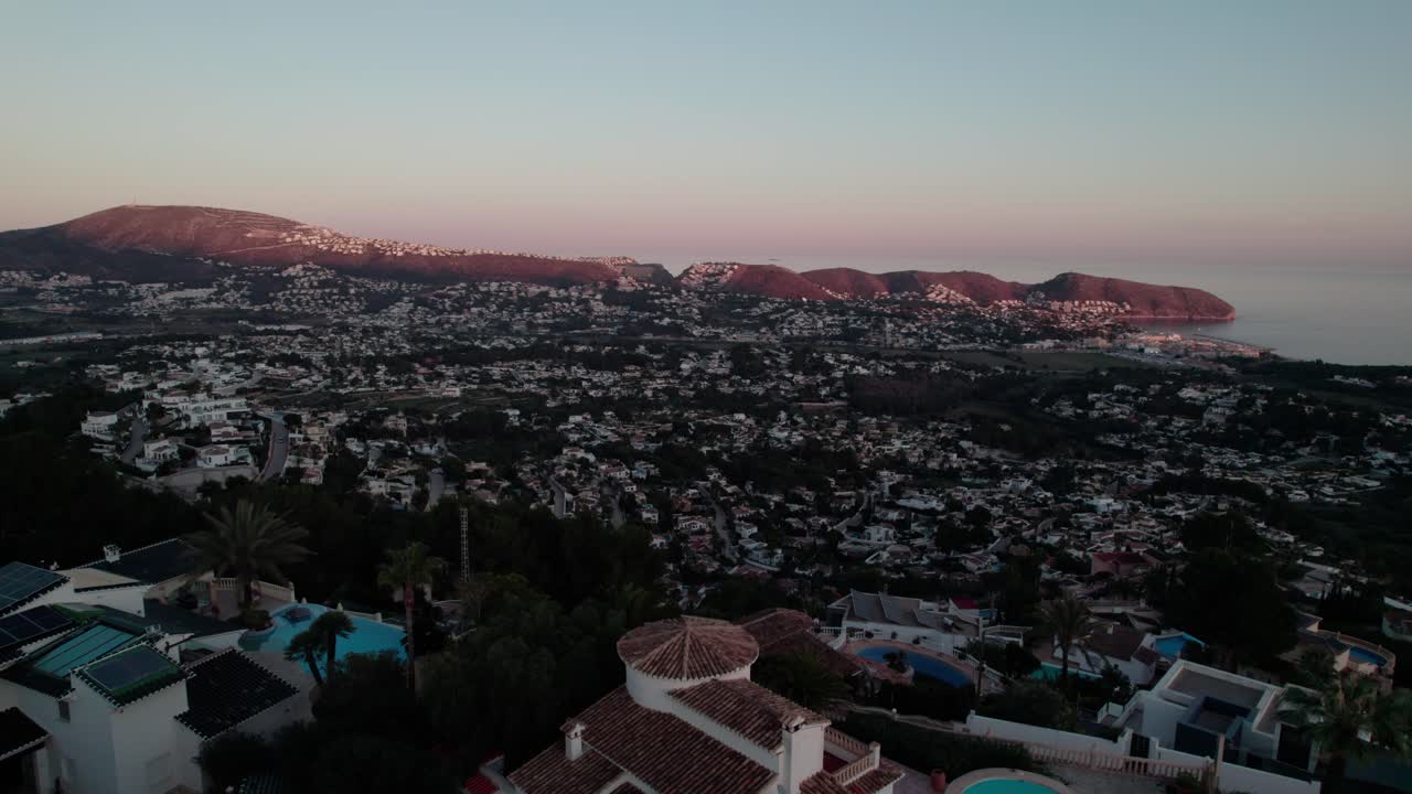 View Of Accommodation In The Town Of Calpe, Alicante, Spain At Sunset - Drone Shot