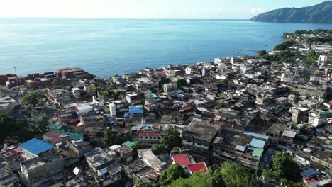 coastal town with historic ruins and lush greenery on anjouan island, comoros, aerial view