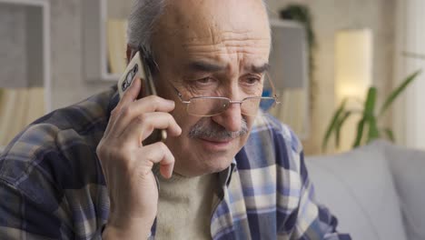 The-old-man-gets-bad-news-and-gets-upset-while-talking-on-the-phone.