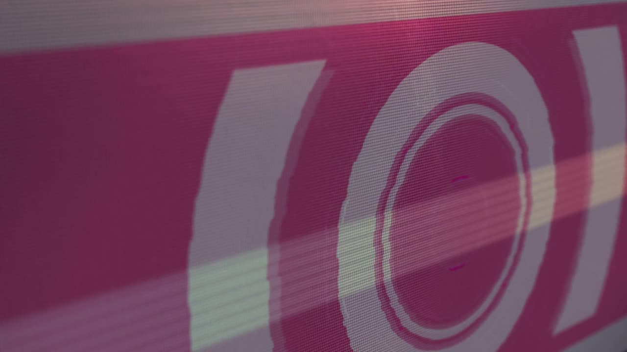 Digital animation of light trails and glitch effect against round scanner on red background