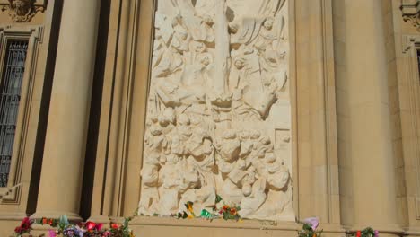 Colorful-Flowers-Offered-At-The-Facade-Of-Cathedral-Basilica-of-Our-Lady-of-the-Pillar-During-Pilar-Festival-In-Zaragoza,-Spain