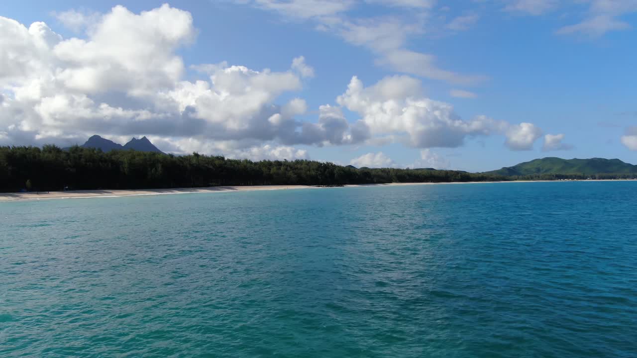 super fast pan across tropical hawaiian beach on a hot day