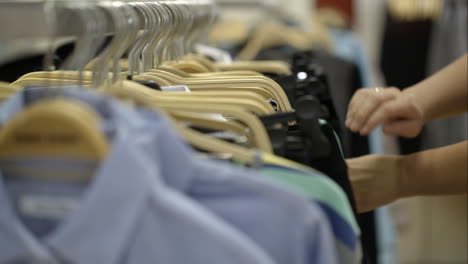 Woman-looking-over-clothes-in-the-store