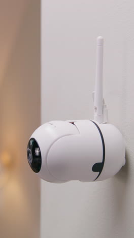 indoor wireless security camera mounted on wall