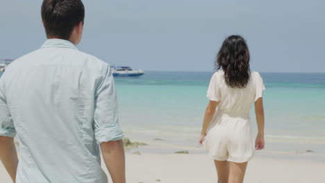 couple walking on a beach