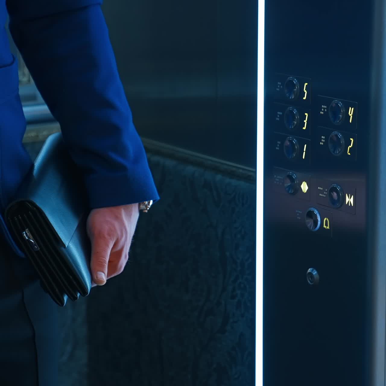 Man pressing elevator button