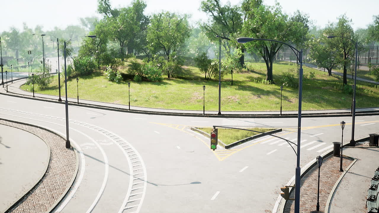Asphalt road and green trees in park