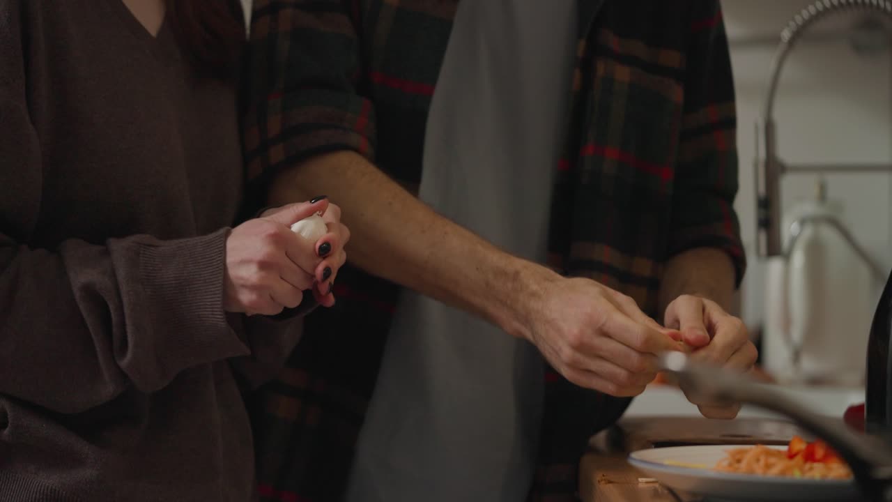 Couple Preparing Meal in Kitchen